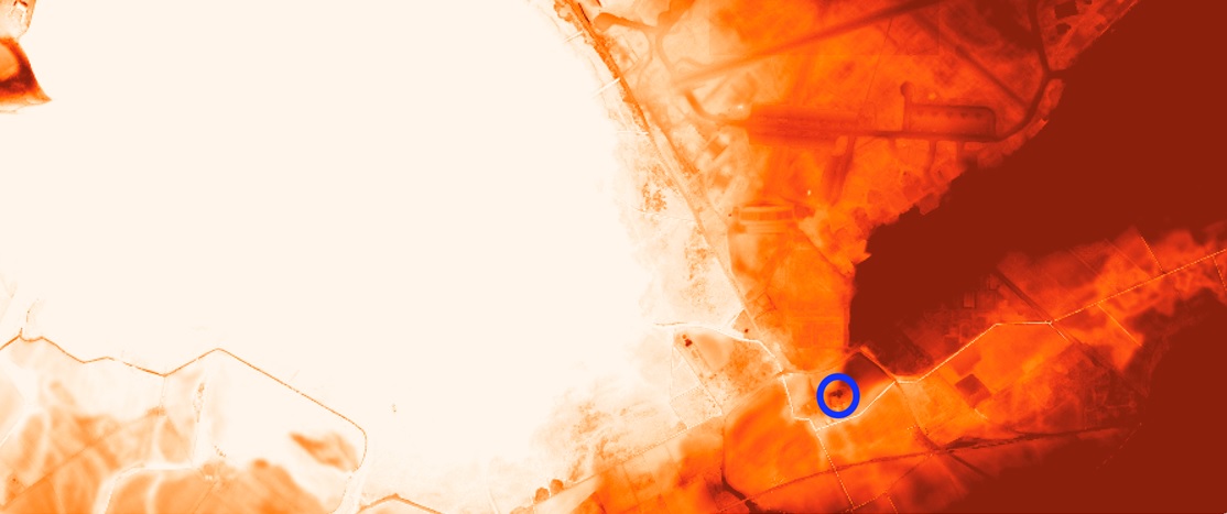 LiDAR image showing a tip of higher land projecting into lower land. A blue circle at the tip of the higher land indicates the site of Kinloss Abbey